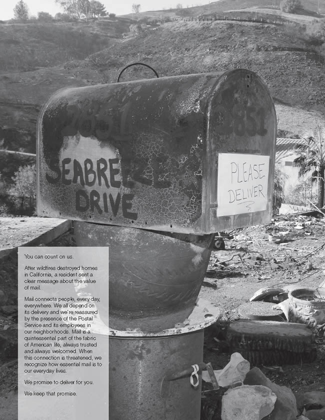 A mailbox in the middle of an open field destroyed by wild fires