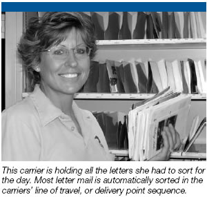 A carrier holding letters that she had to sort for the day.