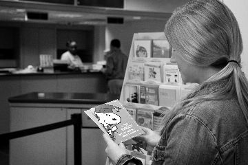 customer shopping for greeting cards in a Postal Retail outlet