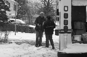 carrier delivering mail in the snow