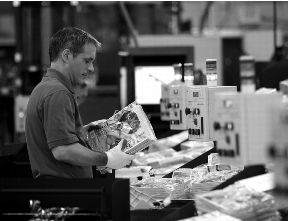 image of a postal employee processing mail